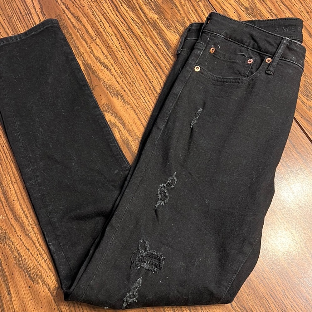 Men’s black distressed jeans.  32x34